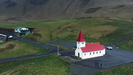 Aerial-drone-shot-of-local-Church-in-Vík-í-Mýrdal,-South-Iceland