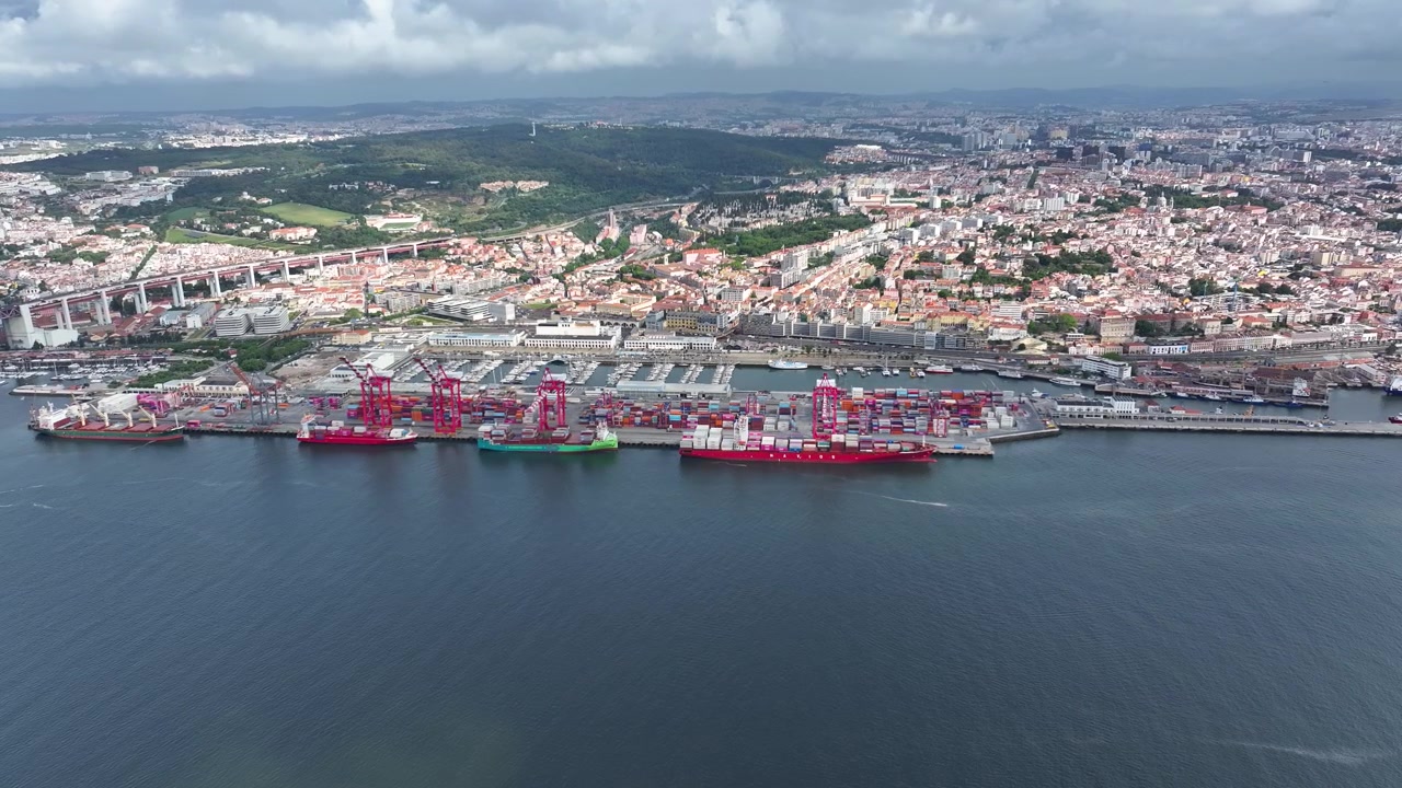 Container ships dock at a bustling cargo port, unloading vibrant shipping containers while cranes are busy at work. This illustrates the vital role of maritime logistics in global trade.