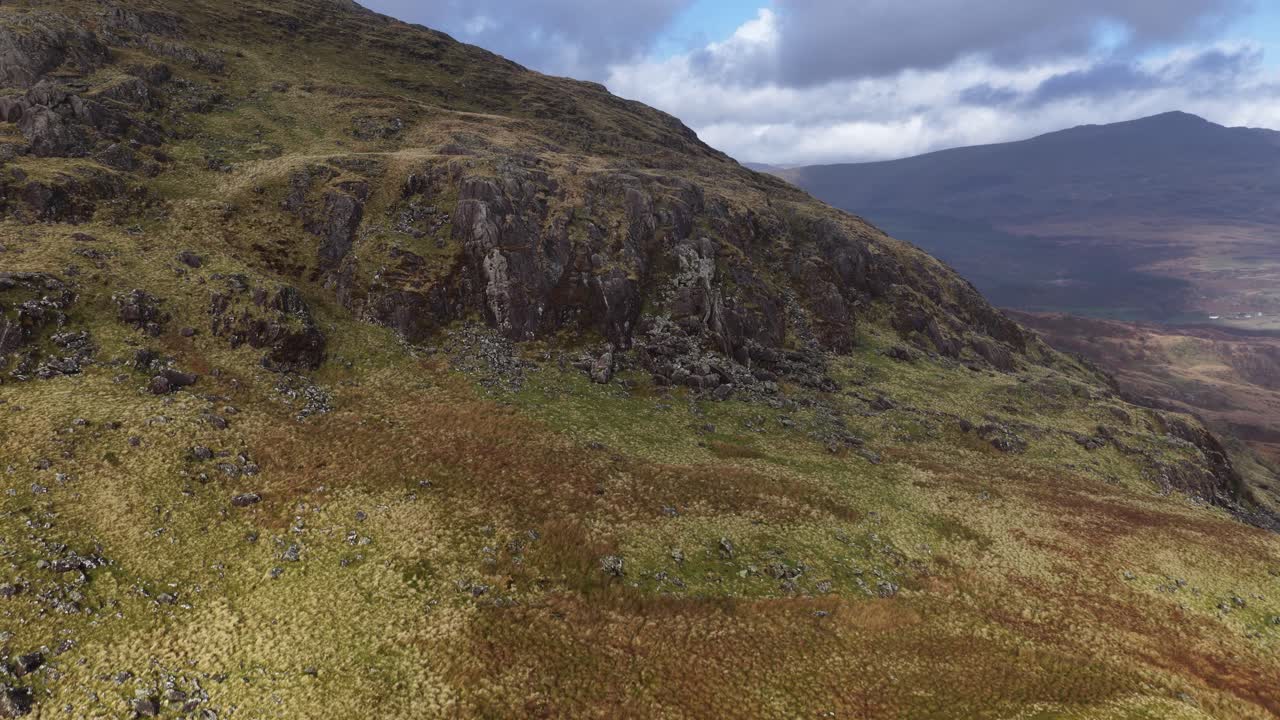 Aerial drone video showcasing the rugged highland landscapes of Snowdonia in North Wales, capturing dramatic mountains, natural wilderness, and sweeping scenic beauty