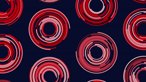 spiraling red oval circles on black background