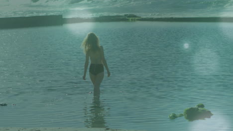 walking into calm water, person enjoying gentle waves with serene animation