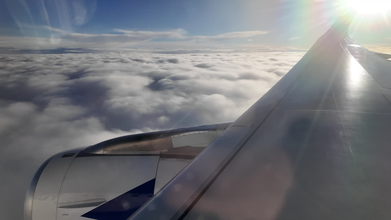 View from an airplane window of the snowed mountains