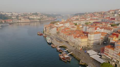 aerial drone shot over the douro river in porto - portugal