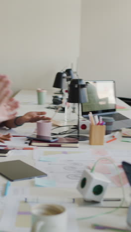 professionals discussing and collaborating in an office meeting