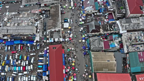 crowd of people and cars at accra central market