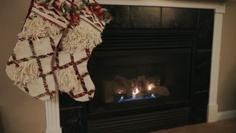 christmas stockings next to a fireplace