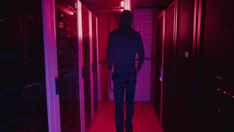 hacker in a server room