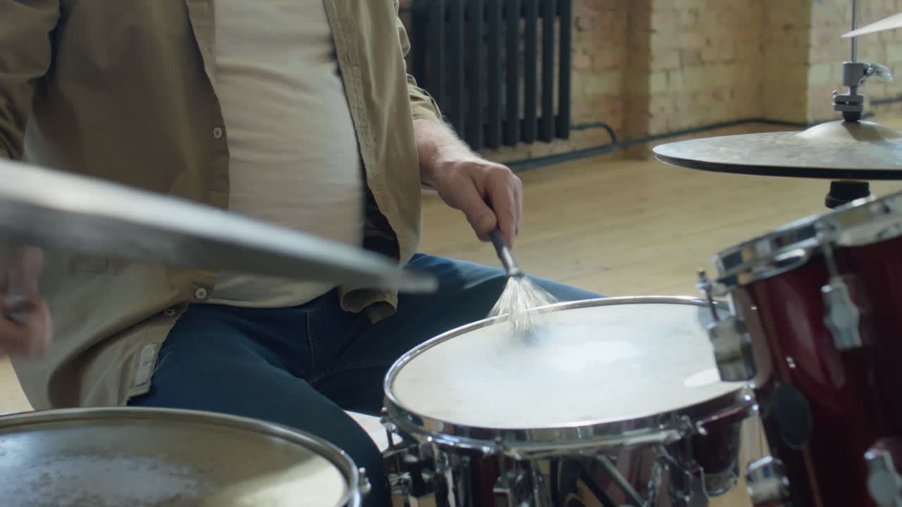 Senior Musician Drumming in Studio