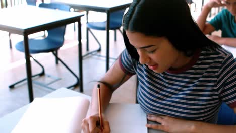 Schoolgirl-studying-in-classroom