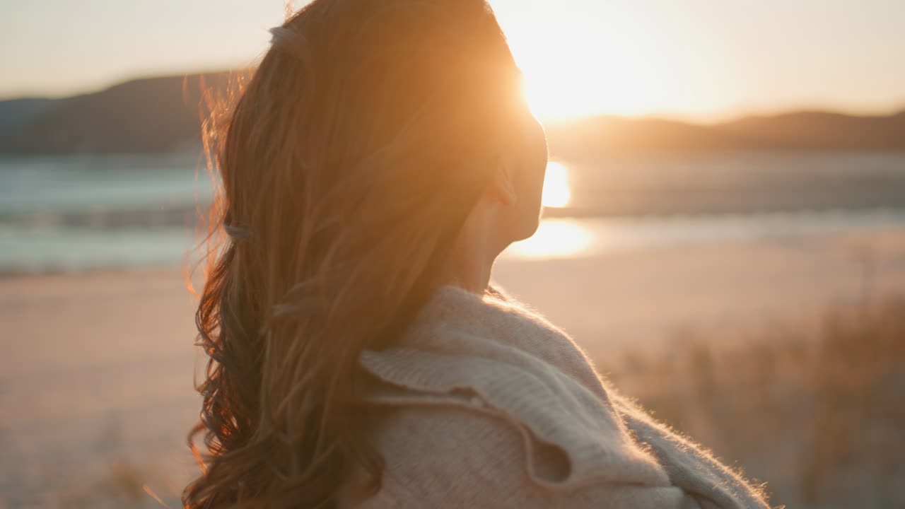 Dreamy lady enjoying sunset relaxing on evening nature closeup. Silhouette woman