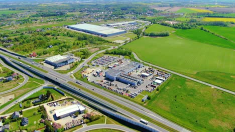 aerial view of warehouse storages or industrial factory or logistics center from above. top view of industrial buildings and trucks