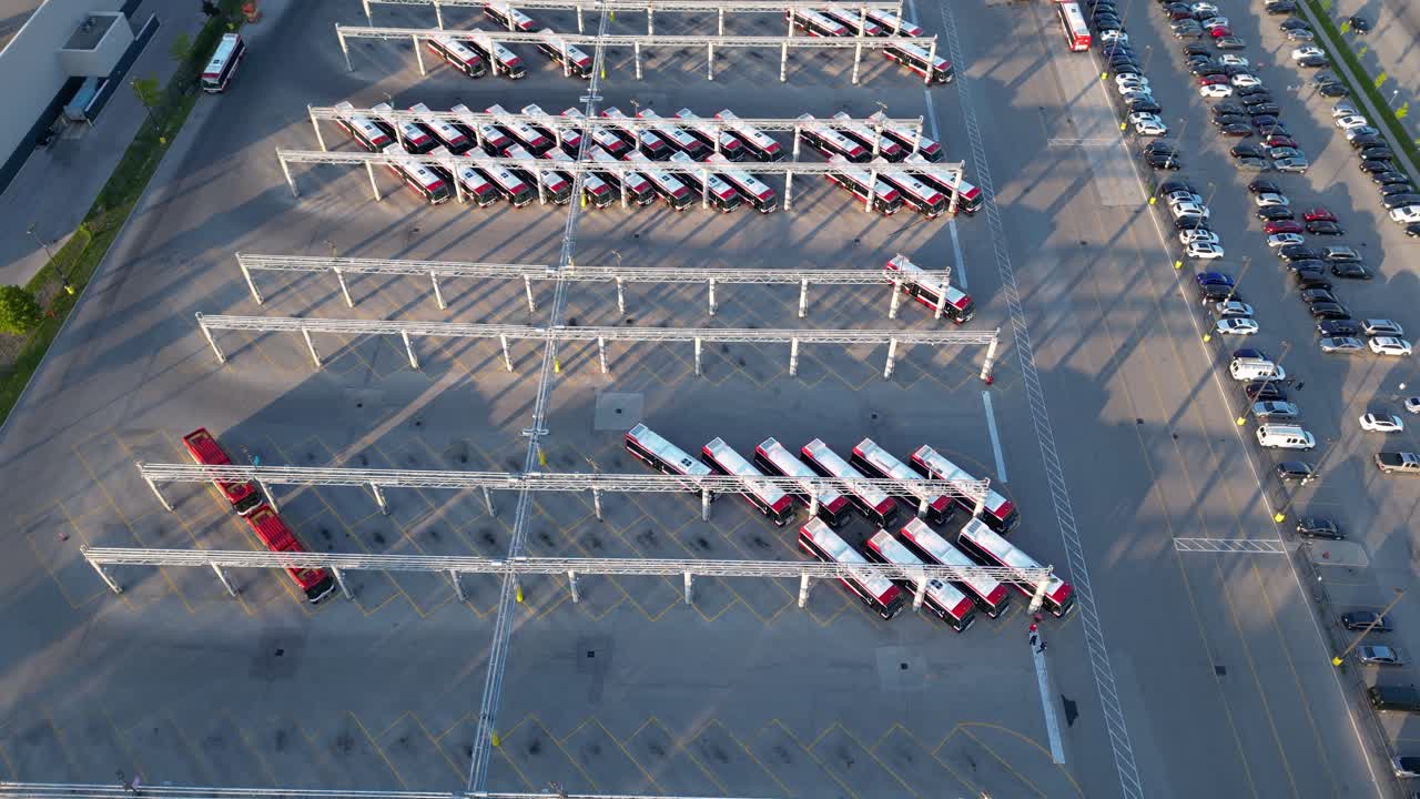 TTC public transit electric buses charging at transportation depot in urban city