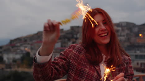 girl dance with sparkles at sunset