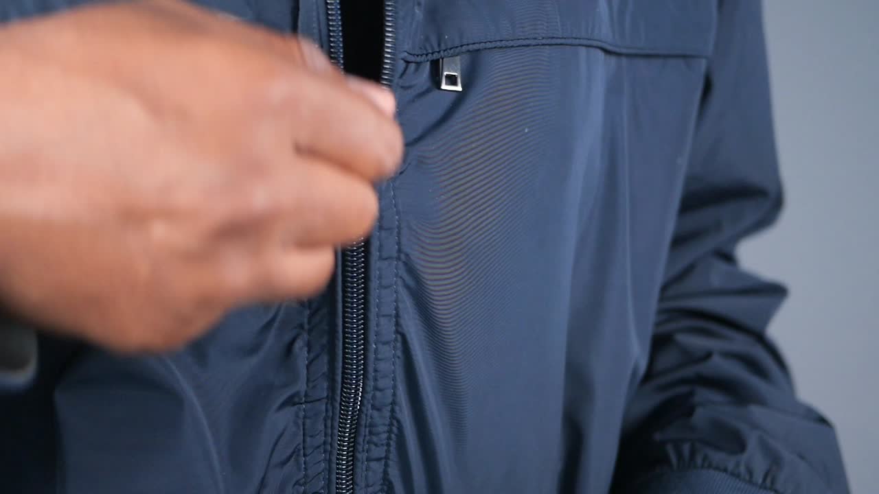 Close-up of a blue jacket with a zipper
