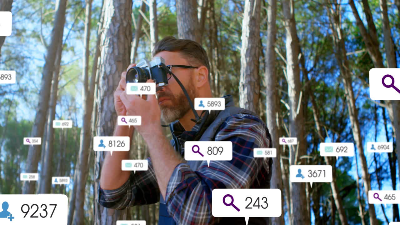Male photographer holding camera among forest, displaying floating social media marketing metrics