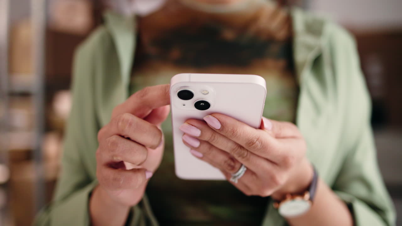 Close Up of Woman's Hands Scrolling on a Smartphone