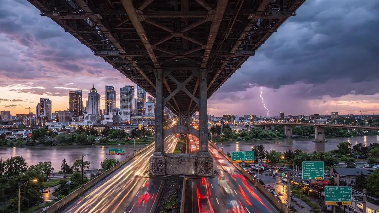 Dynamic Urban Landscape: A Stormy Night Over the City With Lightning Striking, Showcasing Skyscrapers, Traffic, and a Dramatic Sky Underneath the Bridge