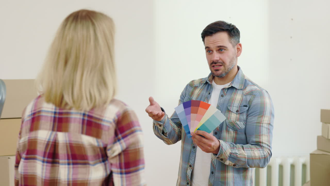 Couple Choosing Paint Colors for New Home