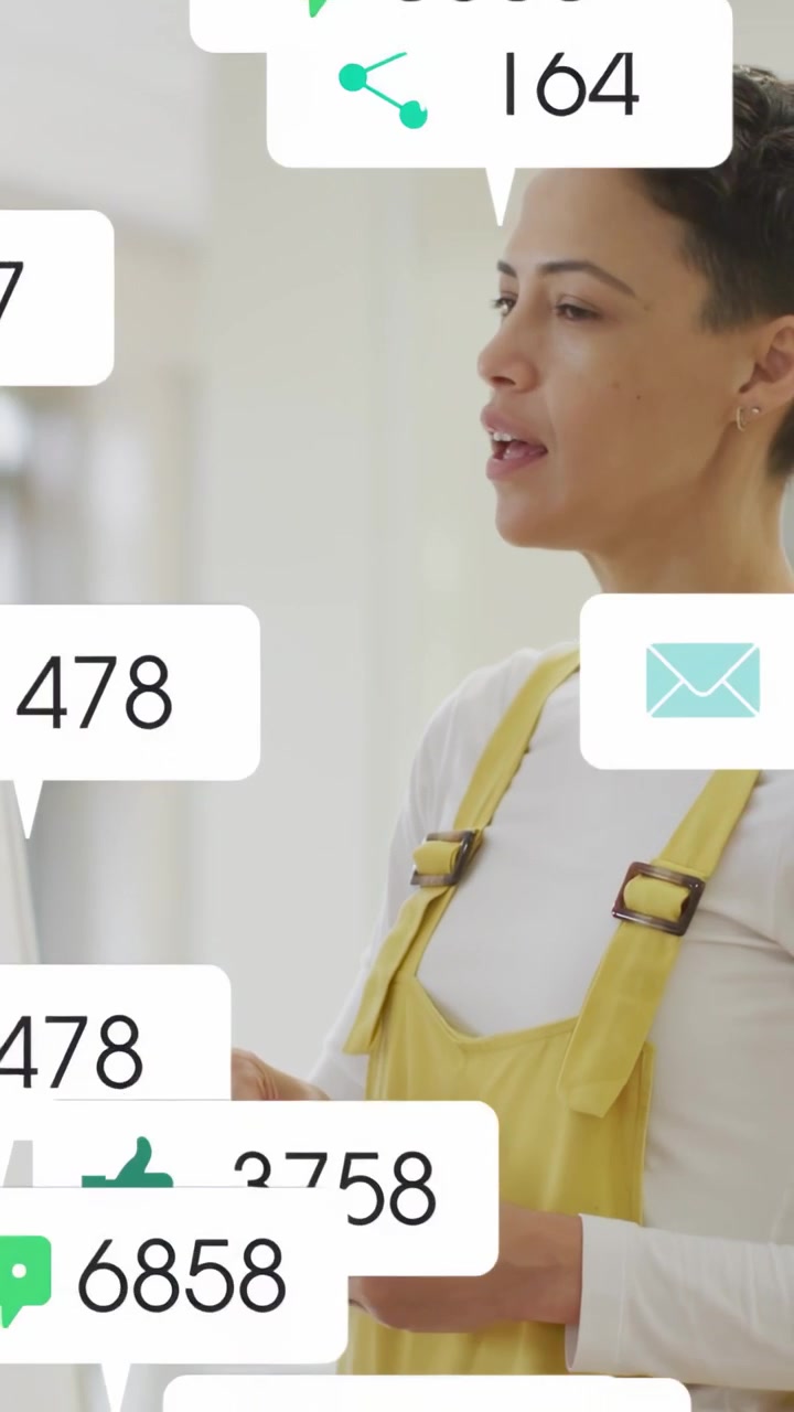Vertical video: Host reaching toward board causing scrolling icons stacking over face for marketing