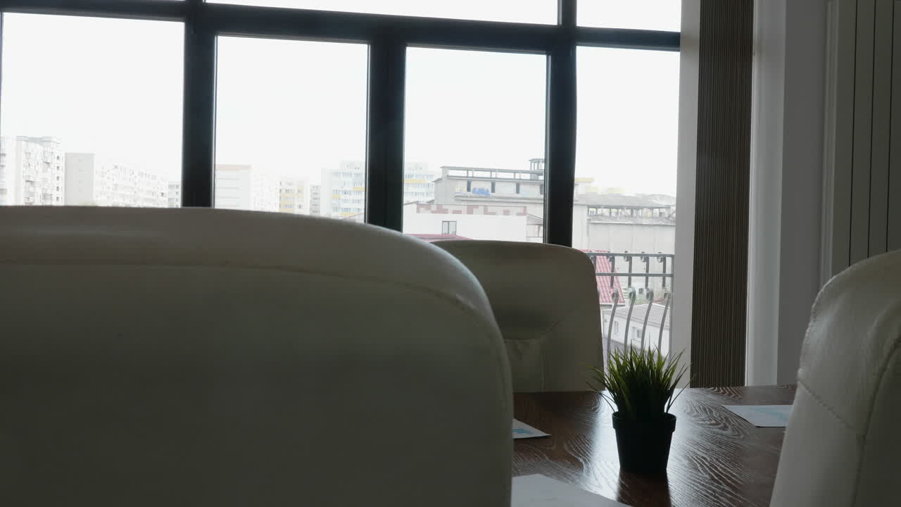 Office interior with chairs and a view of the city