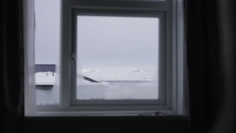 window view into the frozen countryside, iceland