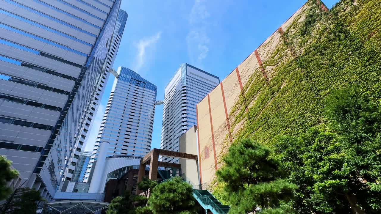 Modern Skyscrapers and Green Wall in a Japanese City