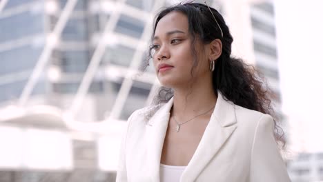 smiling businesswoman in city