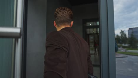 businessman leaving building