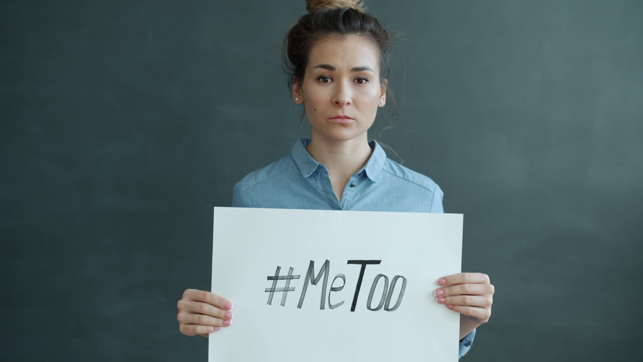 Woman holding a #MeToo sign