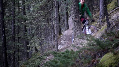 biker riding downhill on a cloudy day