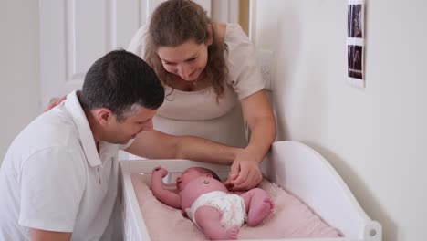 family moments with a newborn baby in a cozy crib a warm family scene in a cozy nursery cherishing precious moments together with their newborn baby