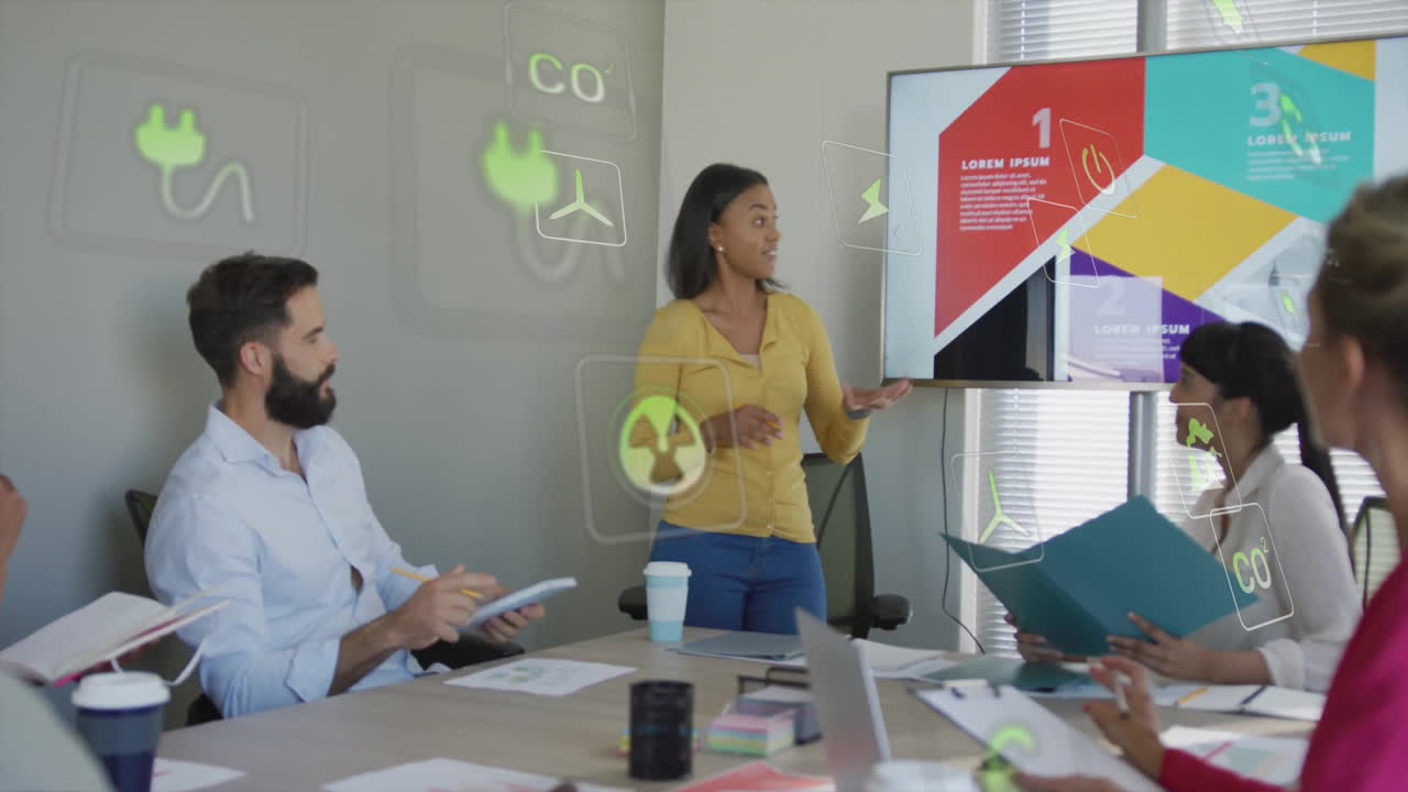 Discussing eco-friendly animation, business team in meeting with digital icons in office