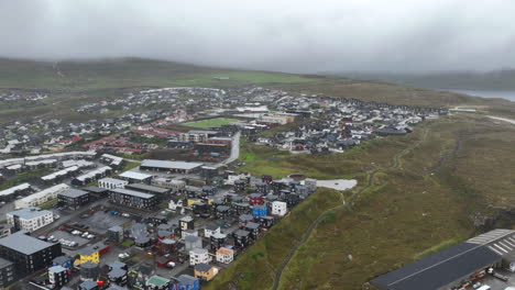 aerial flying forward over torshavn on very stormy day, faroe islands