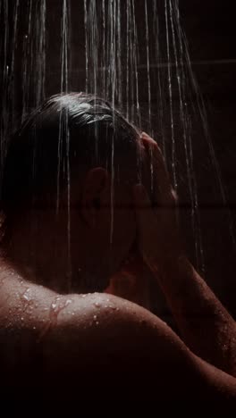 relaxing shower routine featuring a person washing hair in a calming environment