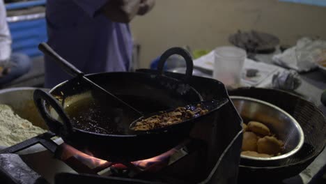 street food being fried at night with time lapse of the process