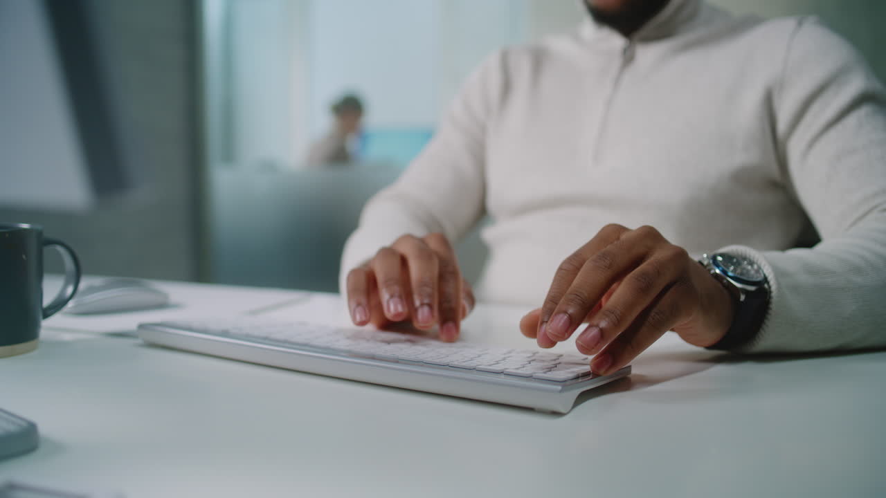 Man Typing on a Computer Keyboard
