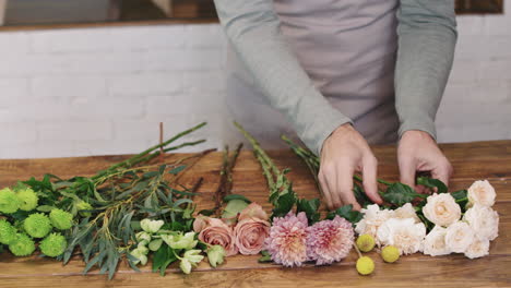 portrait of senior florist in flower shop