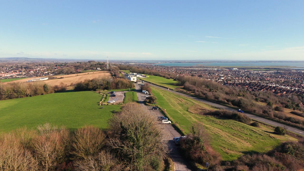 Fort Widley Swanick Hill Portsmouth, low flight over the arched fortifications and viewpoint at the repurposed military fort looking across Portsmouth and out to the Solent in bright sunshine
