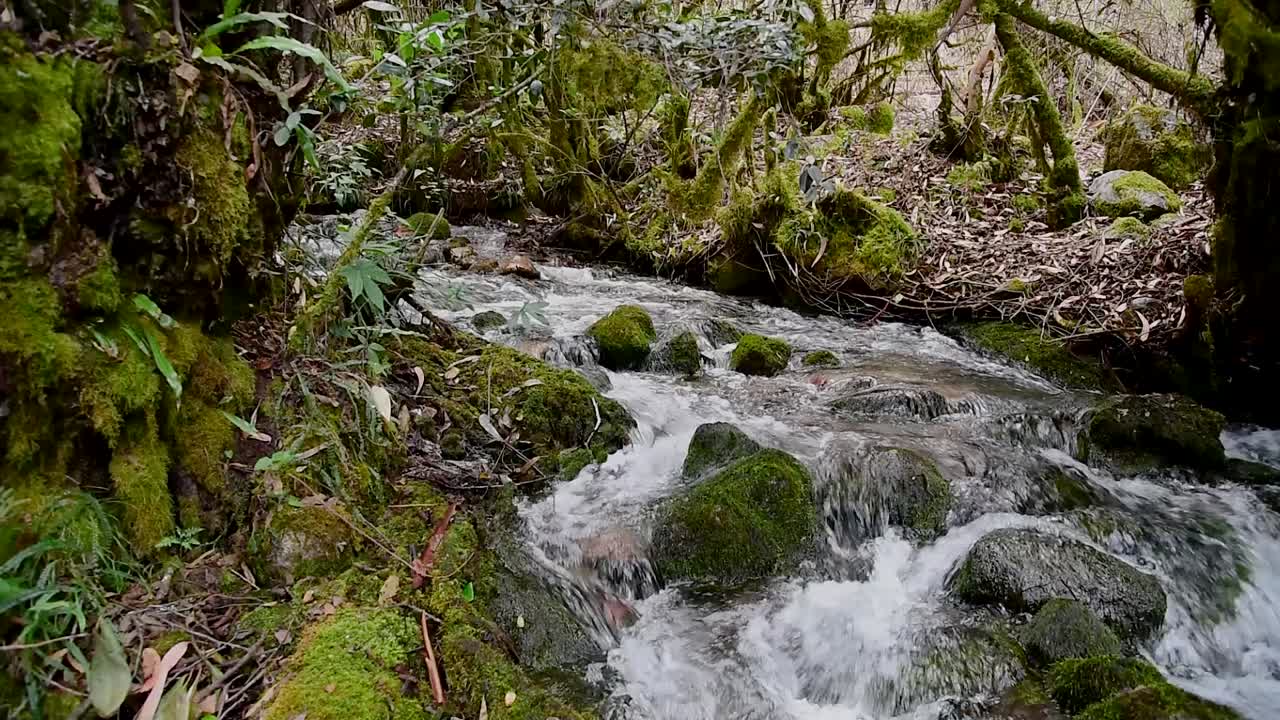 Static shot of clean water flowing by Pumahuanca´s creek in Urubamba Cuzco