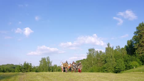 Drone-rotation-of-medieval-knights-with-swords-and-shields-during-ritual-dance