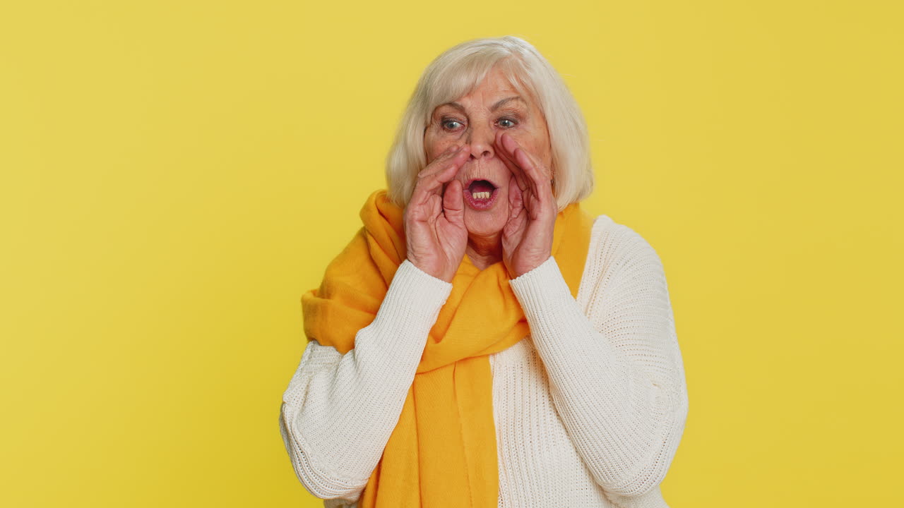 Senior old woman whisper news rumors holding hands near mouth share gossip quiet keep my secrets