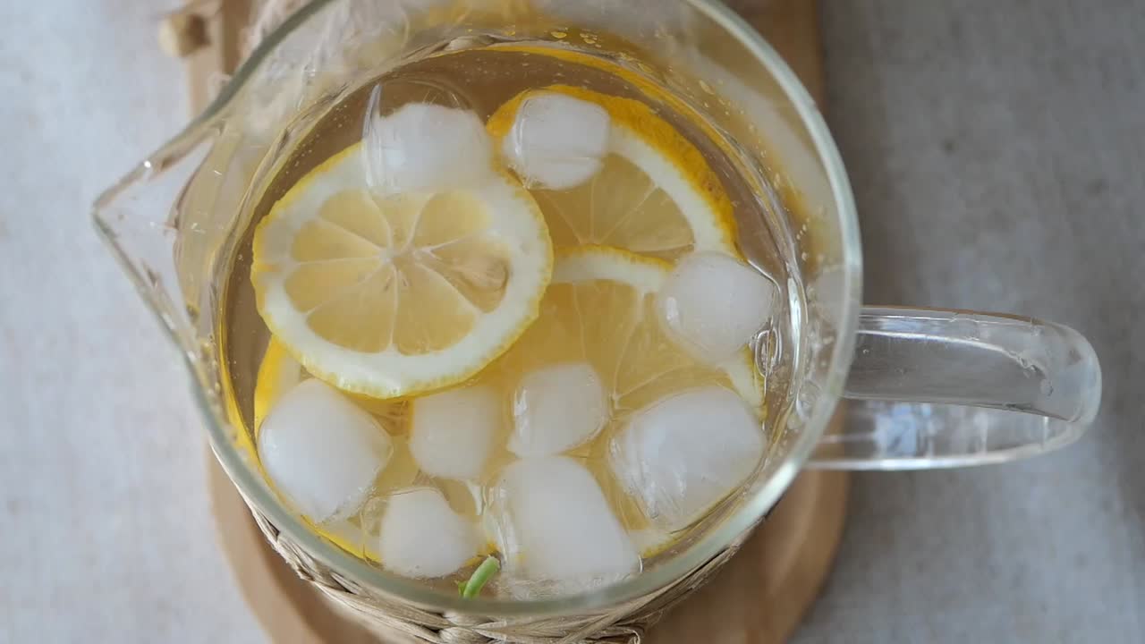 Refreshing Lemonade with Ice in a Pitcher