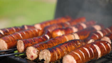 delicious fried sausages on home barbecue