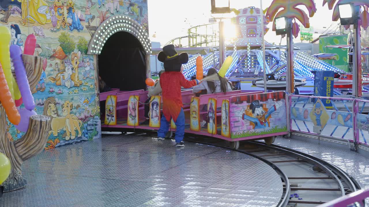 Cartoon Character Performers at Amusement Park Ride