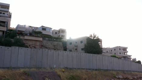 palestine anata refugges camp behind concrete wall -aerial