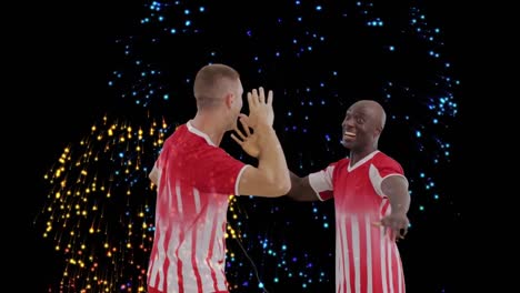 animation of fireworks over diverse male soccer players raising hands