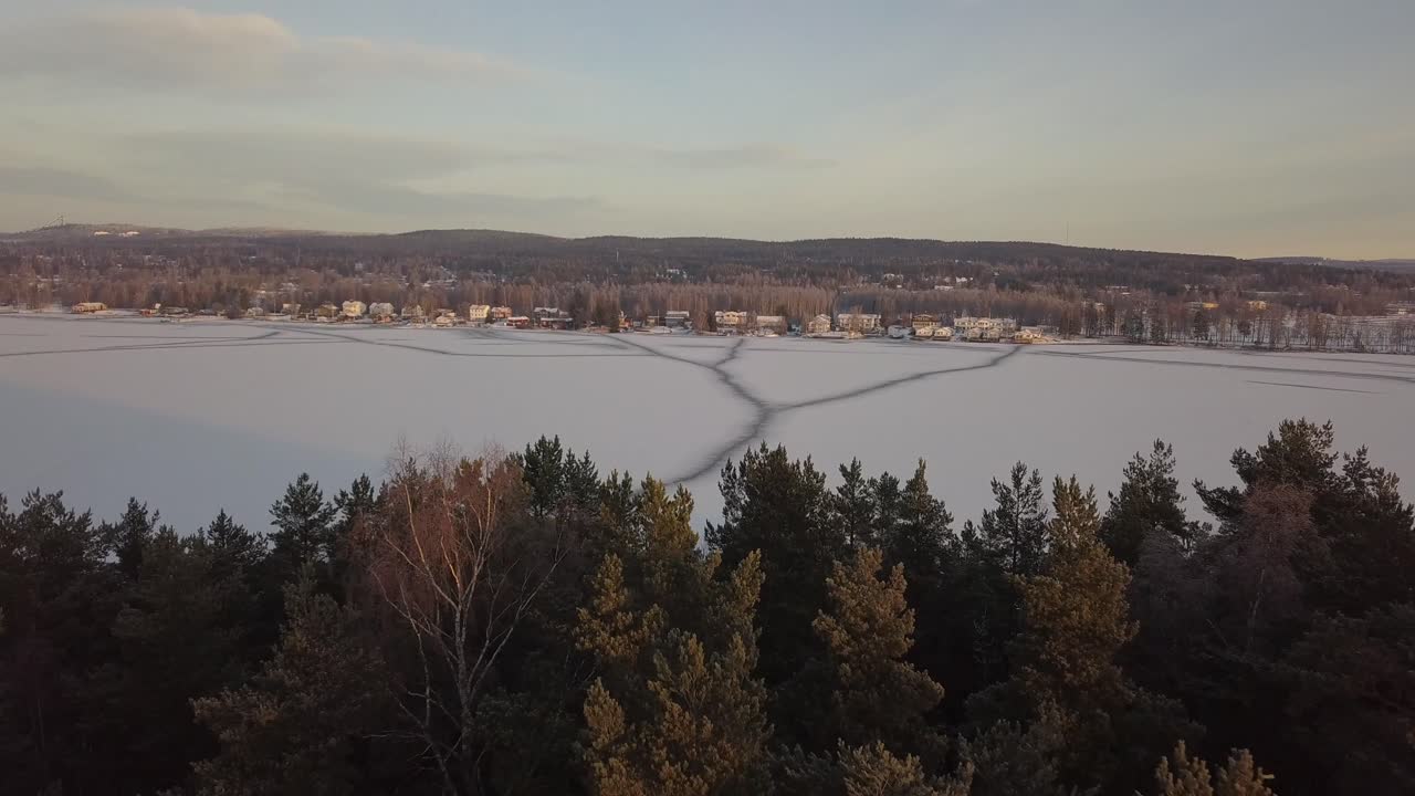 Frozen lake in Falun, Sweden during a cold winter in December, filmed with a drone