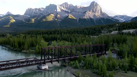 drone shot toward mountain + bridge