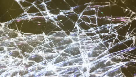 closeup of cracked glass illuminated by white light macro video closeup of cracked glass illuminated by white light macro video