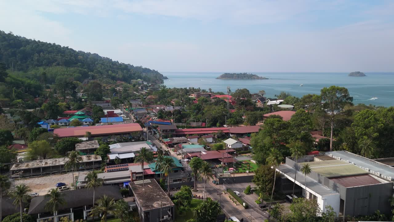 aerial drone footage of Kai Bae village on Koh Chang island with hotel accommodation and the ocean and Island from a high angle